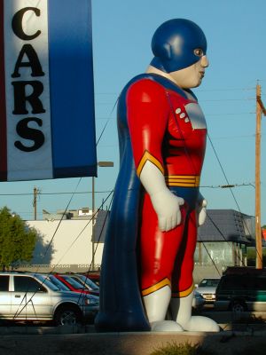 Unidentified superhero sells used cars.
