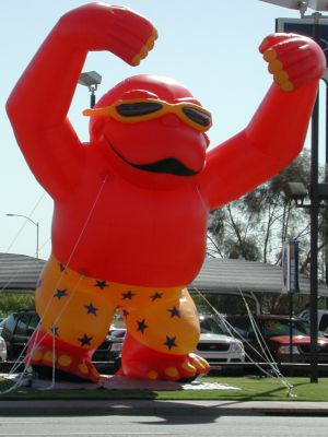 Giant red gorilla sells Fords.

