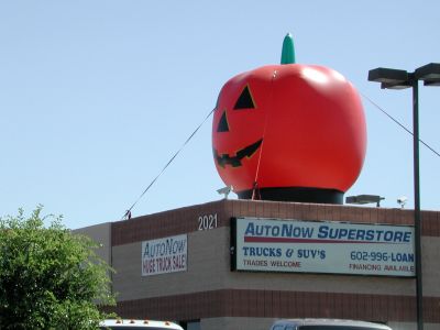 Giant pumpkin sells used cars.
